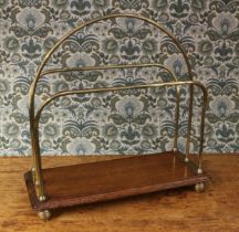 Interior Furnishings - an Edwardian oak and brass periodical rack, arched central division, ribbed