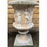 A 19th/20th century gritstone Medici-type half fluted campana shaped urn, in relief with classical