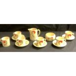 A Royal Doulton Art Deco Aston/Lynn pattern coffee set, six coffee cans, five saucers, cream jug and