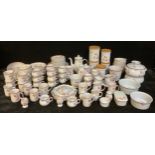 A comprehensive Denby Twilight pattern dinner, coffee and tea set, including kitchen storage jars,