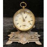 A 19th century drum head mantel clock, brass case, spelter base mounted with putto, approx. 16cm