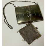 A George V silver rounded rectangular evening purse, engraved with ribbon tied foliate swags,