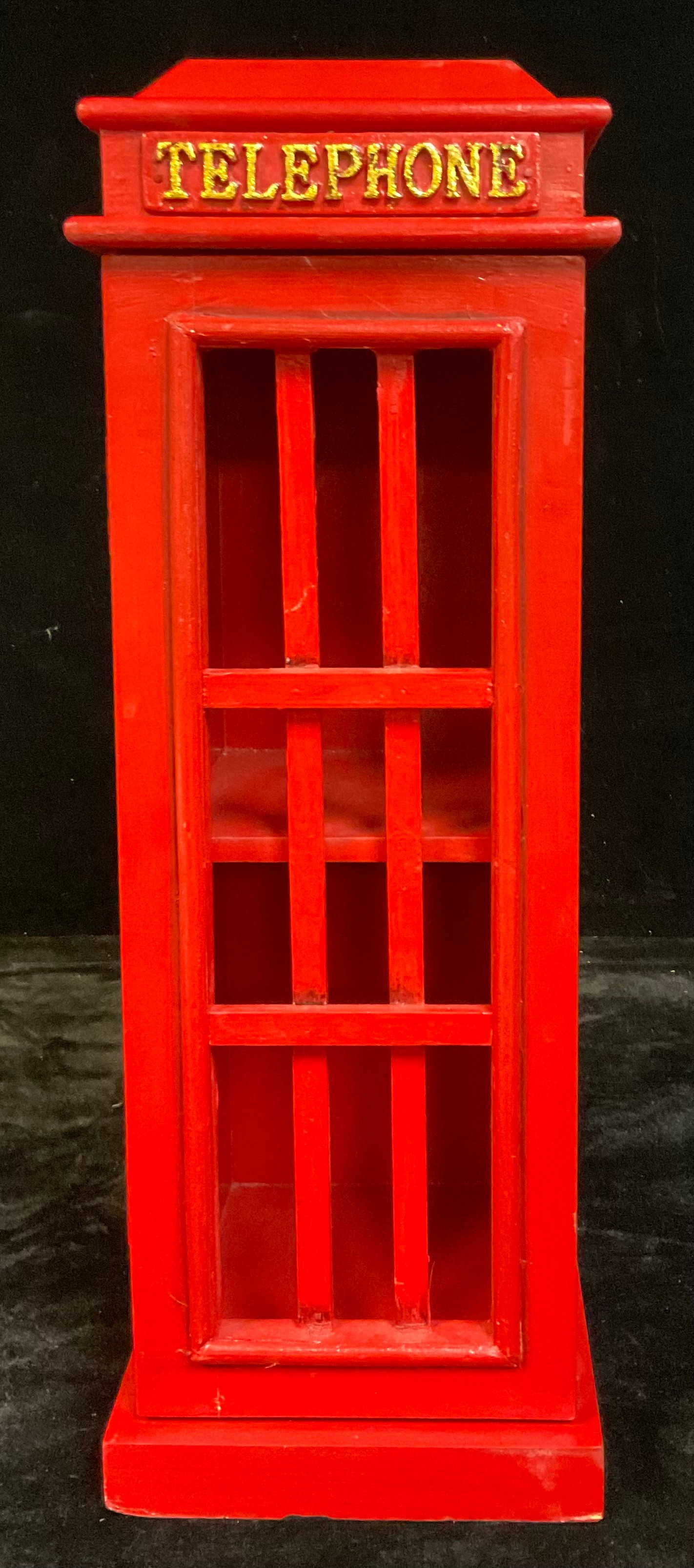 A small wooden cabinet, as a telephone box, painted in red, with hinged magnetic door, 52cm high