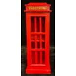 A small wooden cabinet, as a telephone box, painted in red, with hinged magnetic door, 52cm high