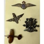 An RAF silver and enamel badge; OCA parachute badge; Spitfire badge; Ypres badge (4)