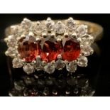 A 9ct gold garnet and cubic zirconia ring, size U, marked 375, 3.6g