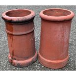 A near pair of terracotta chimney pots, 46cm high, 26.5cm diameter
