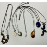 Jewellery - a collection of six silver mounted pendants on neck chains (6)
