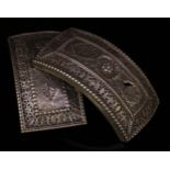 A pair of Indian silvered metal buckles, pierced and engraved with stylised lotus and scrolls,
