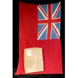 A British Naval red ensign flag, boxed - the box lid with label for Woollens of Keswick