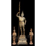 A brass floor standing fireside companion, as a 16th century chivalric knight, standing as a