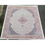 A large Persian style carpet in cream blue & pink 324 cm by 239.5 cm