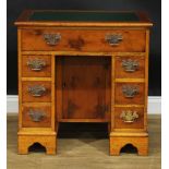 A George III style yew veneer and mahogany kneehole desk, rectangular top with inset writing surface