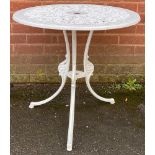 A circular metal garden table, painted white, 65.5cm high, 68cm wide