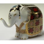 A Royal Crown Derby paperweight, Imari Elephant, trunk raised, gold stopper, boxed