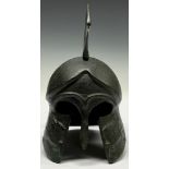 A museum type patinated bronze model, of an Ancient Greek helmet, 19cm high