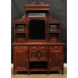A late Victorian parlour cabinet, shaped superstructure with bevelled mirrors, the projecting base