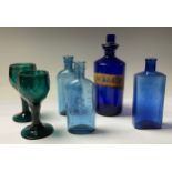 A 19th century blue glass apothecary bottle, gilt label SYR.SCILAE, 20cm high; a pair of 19th