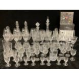 A cut glass decanter, five others cut glass and moulded; four Royal Doulton white wine glasses, pair