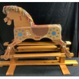 A 1980s vintage hand made rocking horse varnished body, pine cradle, metal hinges, signed, dated