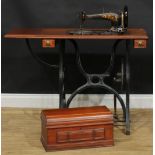 An early 20th century Medium treadle sewing machine