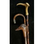 Walking Sticks - a silver mounted bamboo walking stick, London 1914; another, the handle carved as a