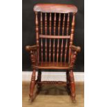 A country cottage rocking chair, 103.5cm high, 58cm wide, the seat 39cm wide and 33cm deep