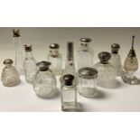 A silver mounted rectangular cut glass dressing table scent bottle, 14cm high, London 1912; another,