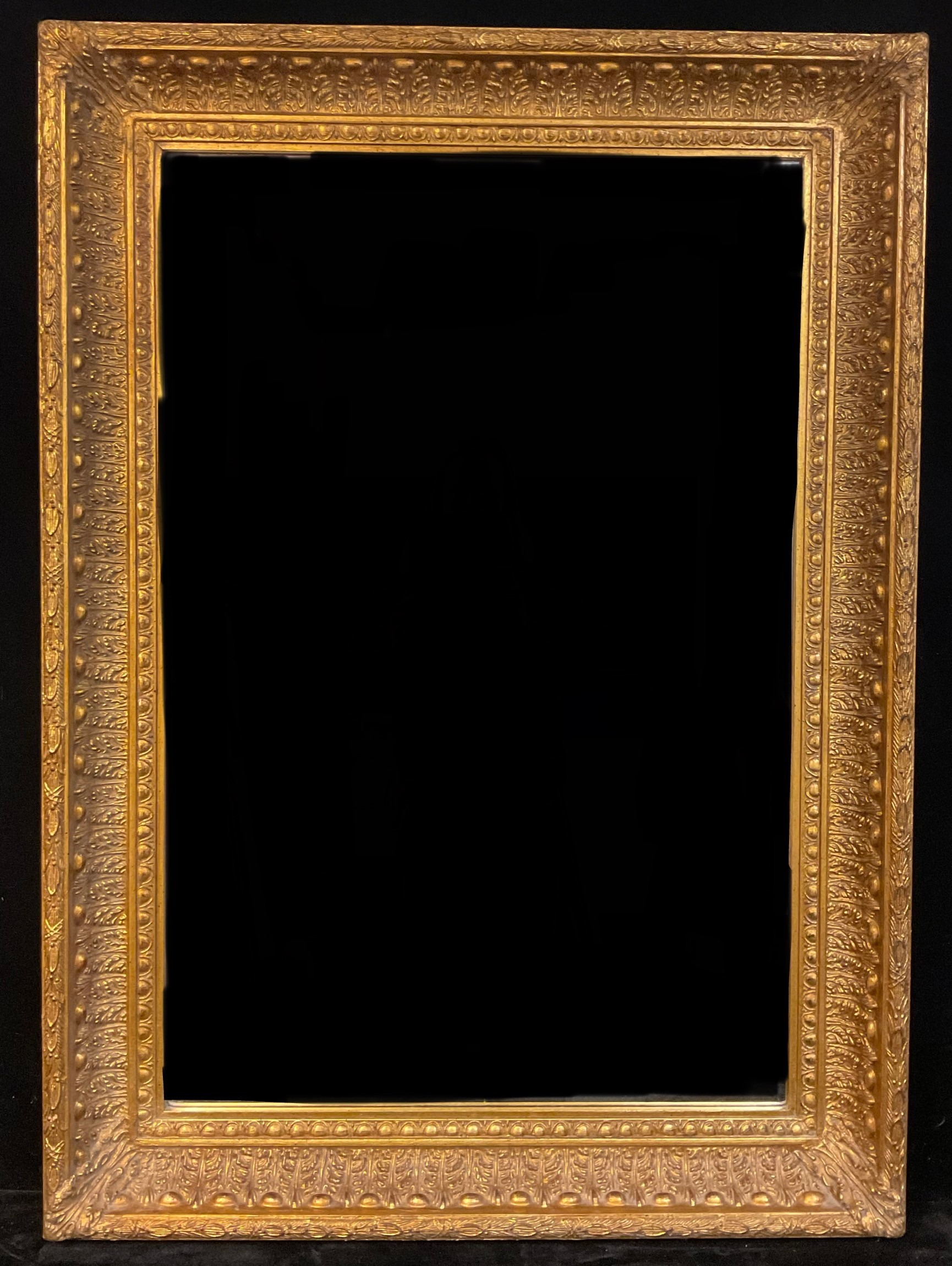 A large 19th century style gilt framed mirror or looking glass, bevelled plate, 110cm x 80cm