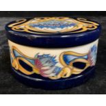 A Moorcroft circular bowl and cover, tube lined with cornflowers within ribbons of yellow,