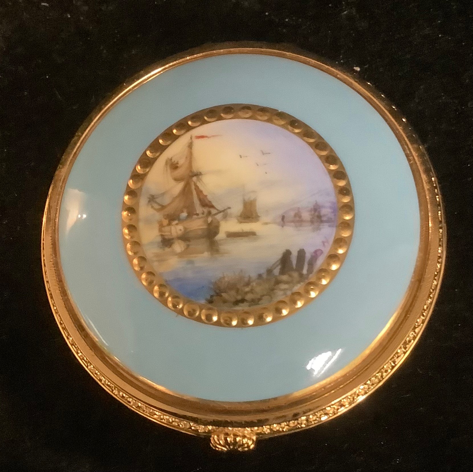 A Lynton porcelain circular table box, painted by Stefan Nowacki, signed, with schooners off the - Image 2 of 2
