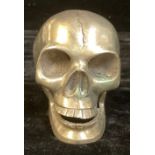 Memento Mori - a cast metal model of a human skull, with articulated lower jaw, 9.5cm high