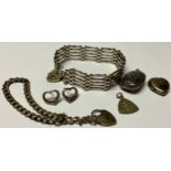 A silver gate link bracelet, heart padlock, London 1979; another similar; three silver pendants; a