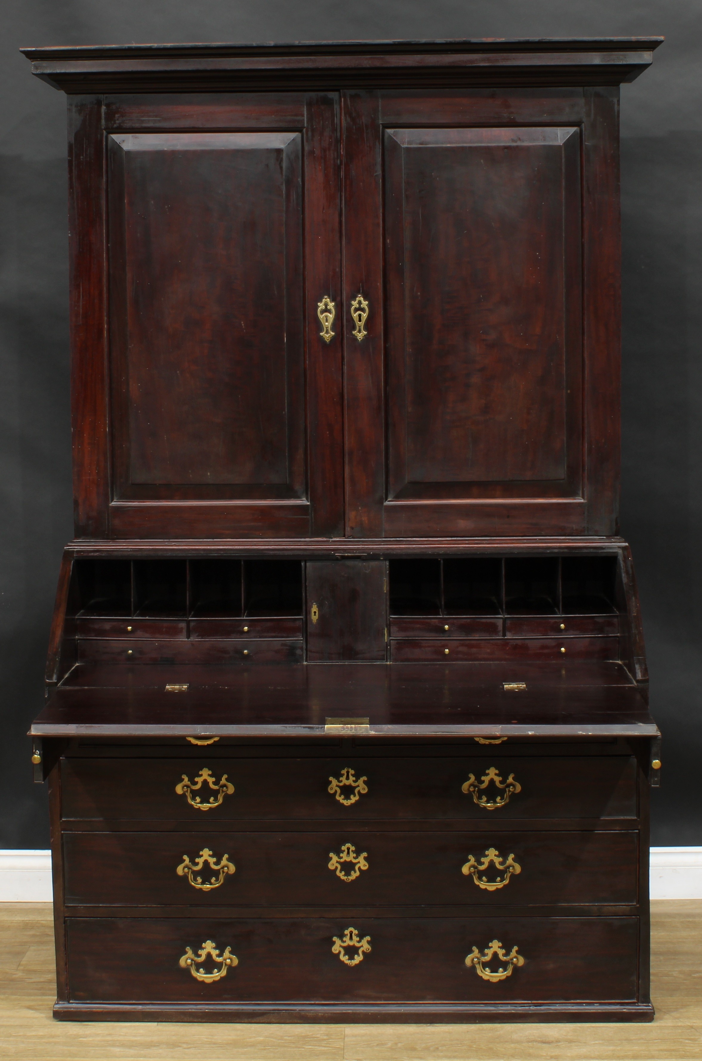 A George III red walnut and mahogany bureau book cabinet, for restoration, 190.5cm high, 127cm wide,