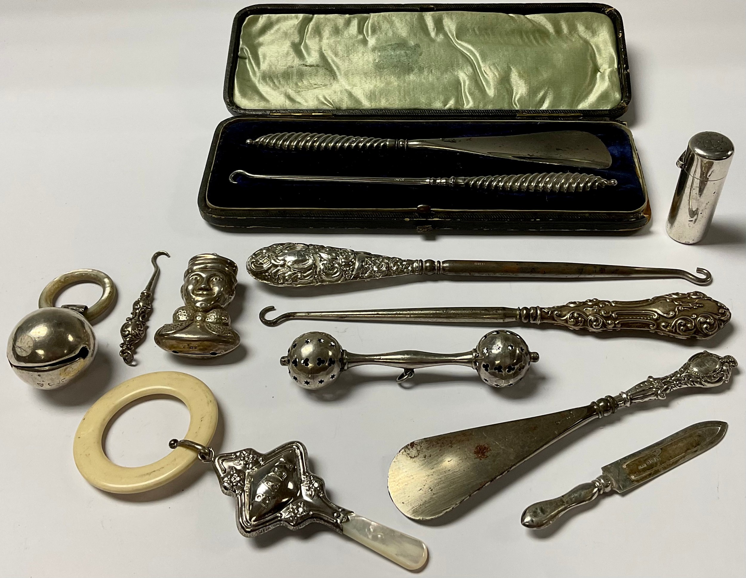 A silver baby rattle, Birmingham hallmarks; others; a silver bookmark; a silver scent bottle, London