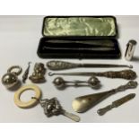 A silver baby rattle, Birmingham hallmarks; others; a silver bookmark; a silver scent bottle, London