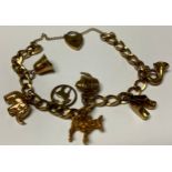 A 9ct gold curb link charm bracelet, including, French horn, pair of clogs, teapot, donkey,