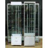 Five shop display cabinets or showcases, the largest 197.5cm high, 50cm square (5)