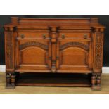 An early 20th century oak side cabinet, carved with blind fretwork in the 17th century taste, 105.