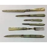 A Victorian silver and mother-of-pear fruit knife, 13.5cm open, London 1875; three others similar; a