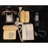 A mid 20th century black bakelite telephone; others, retro 1970s/80s (5)