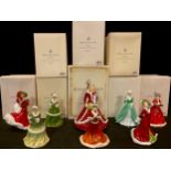A Royal Doulton figure, Christmas Day 2011, Christmas Wish, HN5429, 22cm, certificate boxed; a set