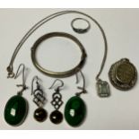 A pair of silver and malachite earrings; Celtic earrings; a silver bangle; pendant; etc