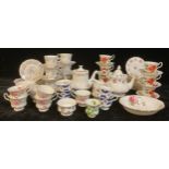 A set of six Royal Albert Poinsettia pattern tea cups and saucers; five Royal Albert Moss Rose