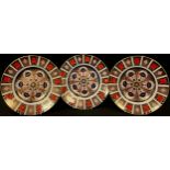 A set of three Royal Crown Derby 1128 pattern dinner plates, 27cm diameter, second quality