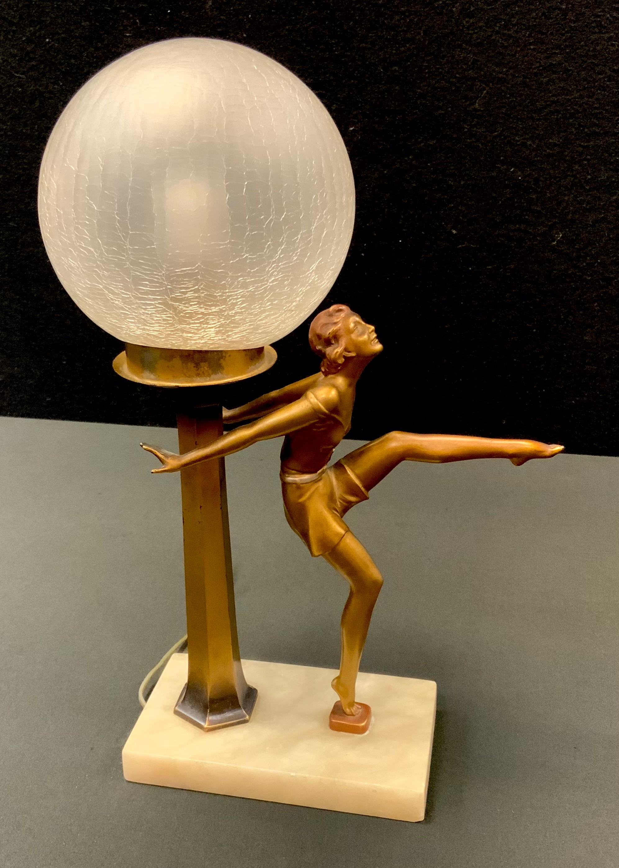 An Art Deco patinated spelter table lamp, Joseph Lorenzl style Dancing Girl, crackle glass