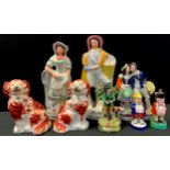 A pair of 19th century Staffordshire flatback figures, Fish sellers, 34cm high ; others Spaniels,