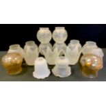 A set of eight frosted globular glass lamp shades, floral decoration, wavy rims, approx 14cm high,