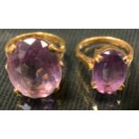 A 9ct gold pale pinky purple amethyst dress ring, size O/P, 8.6g gross; another smaller, size M, 4.