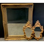 A rectangular gilt framed wall mirror, bevelled plate, 112c, x 82cm overall; a pair of baroque style